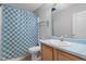 Bathroom featuring modern fixtures, a blue shower curtain, and a vanity sink at 627 Gaslight Trl, Wendell, NC 27591