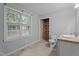 Bathroom with tile floor, a window, a walk-in shower, and a vanity at 627 Gaslight Trl, Wendell, NC 27591