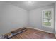 Cozy bedroom featuring new wood floors and a bright window at 627 Gaslight Trl, Wendell, NC 27591