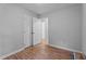 Bedroom featuring hardwood floors, natural light, and closet space at 627 Gaslight Trl, Wendell, NC 27591