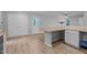 Open dining area features wood flooring, a breakfast bar, and access to exterior at 627 Gaslight Trl, Wendell, NC 27591