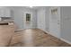 Eat-in kitchen featuring access to the backyard and stainless steel appliances at 627 Gaslight Trl, Wendell, NC 27591