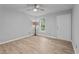 Bright living room with hardwood floors, neutral walls, and a ceiling fan at 627 Gaslight Trl, Wendell, NC 27591