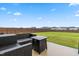 Spacious backyard with a well-maintained lawn, wooden fence, and comfortable outdoor seating area for relaxation at 66 Arlie Ln, Lillington, NC 27546