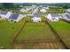 Aerial view of a large, well-maintained backyard enclosed by a wood fence, offering privacy and space at 66 Arlie Ln, Lillington, NC 27546
