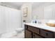 Bathroom featuring a shower with curtain, a vanity with dark wood cabinets and decor at 66 Arlie Ln, Lillington, NC 27546
