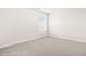 Bright bedroom with neutral carpet, window and blinds; ready for personalization at 66 Arlie Ln, Lillington, NC 27546