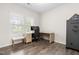 Bedroom with a desk, chair, gun safe and natural light from the window showing the yard outside at 66 Arlie Ln, Lillington, NC 27546