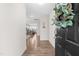 Bright entryway showcasing hardwood floors and a view into the kitchen and dining areas, creating an inviting atmosphere at 66 Arlie Ln, Lillington, NC 27546