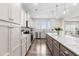 Spacious kitchen with granite countertops, white cabinets, stainless appliances, and a large center island at 66 Arlie Ln, Lillington, NC 27546