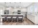 Beautiful kitchen with granite countertops, stainless steel appliances, island seating, and modern lighting at 66 Arlie Ln, Lillington, NC 27546