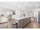 Open kitchen featuring a granite island with seating, and a view into the living and dining areas at 66 Arlie Ln, Lillington, NC 27546