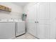Laundry room with washer and dryer, shelving, and storage at 66 Arlie Ln, Lillington, NC 27546