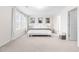 Bright main bedroom with natural light, bedside tables and tasteful decor at 66 Arlie Ln, Lillington, NC 27546