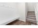 Mudroom with built-in bench and coat hooks and staircase nearby at 66 Arlie Ln, Lillington, NC 27546