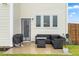 A cozy outdoor patio with comfortable seating and a fire pit for relaxing evenings at 66 Arlie Ln, Lillington, NC 27546