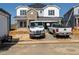 Exterior view of home under construction with a brick facade and white siding details at 667 White Birch Ln, Angier, NC 27501