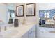 Bathroom with dual sinks, a vanity, and view into the adjacent Bedroom room at 673 Sun Meadow Dr, Wake Forest, NC 27587