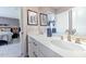 Bathroom featuring dual sinks, quartz countertop, and decorative accents at 673 Sun Meadow Dr, Wake Forest, NC 27587