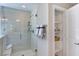 Modern bathroom with glass-enclosed shower and convenient shelving at 673 Sun Meadow Dr, Wake Forest, NC 27587