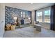 Charming Bedroom with stylish wallpaper, a crib, and natural light at 673 Sun Meadow Dr, Wake Forest, NC 27587