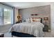 Inviting bedroom with a comfortable bed, sports-themed decor, and natural light at 673 Sun Meadow Dr, Wake Forest, NC 27587