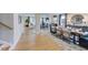 Open-concept dining room featuring hardwood floors, table with seating, and modern decor at 673 Sun Meadow Dr, Wake Forest, NC 27587