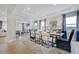Stylish dining area showcases a wooden table set for dinner with an open living concept at 673 Sun Meadow Dr, Wake Forest, NC 27587