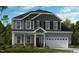 Charming two-story home with a well-manicured lawn and a two-car garage at 673 Sun Meadow Dr, Wake Forest, NC 27587