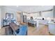 Spacious open floor plan integrates the kitchen, dining area, and stainless steel appliances at 673 Sun Meadow Dr, Wake Forest, NC 27587
