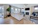 Spacious living room with a fireplace, plush seating, an open floor plan, and access to the outdoor patio at 673 Sun Meadow Dr, Wake Forest, NC 27587