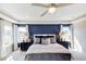 Bright main bedroom features decorative wallpaper and a tray ceiling at 673 Sun Meadow Dr, Wake Forest, NC 27587
