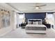 Bright main bedroom features decorative wallpaper and a tray ceiling at 673 Sun Meadow Dr, Wake Forest, NC 27587
