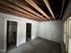 This living room has an open ceiling with exposed beams and lots of natural light at 722 Long Ave, Rocky Mount, NC 27801