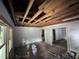 A spacious living room with an open ceiling, windows, and multiple entryways at 722 Long Ave, Rocky Mount, NC 27801