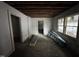 This spacious living room features exposed beams and several windows for natural light at 722 Long Ave, Rocky Mount, NC 27801