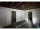 An airy living room features exposed beams and multiple entryways for easy access at 722 Long Ave, Rocky Mount, NC 27801