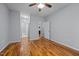 Bedroom with hardwood floors featuring an en suite bathroom and walk-in closet at 8231 Allyns Landing Way # 101, Raleigh, NC 27615