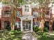 Beautiful brick building featuring manicured landscaping, multiple windows, and covered entryway at 8231 Allyns Landing Way # 101, Raleigh, NC 27615