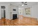 Bright living room featuring hardwood floors, fireplace, and great natural light at 8231 Allyns Landing Way # 101, Raleigh, NC 27615