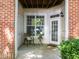 Inviting covered patio with seating area, providing a relaxing outdoor space at 8231 Allyns Landing Way # 101, Raleigh, NC 27615