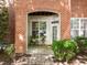 Cozy covered patio with brick accents, perfect for outdoor seating at 8231 Allyns Landing Way # 101, Raleigh, NC 27615
