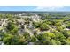 Scenic aerial view of houses with a mix of buildings and businesses nestled among abundant trees, close to downtown at 830 S Chestnut St, Henderson, NC 27536