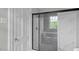 Modern bathroom with a glass-enclosed shower featuring elegant marble tile, offering a luxurious and serene experience at 830 S Chestnut St, Henderson, NC 27536