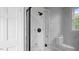 Elegant bathroom features a glass-enclosed shower with marble tile, creating a spa-like atmosphere at 830 S Chestnut St, Henderson, NC 27536