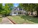 Charming two-story home with black shutters and a well-maintained front lawn at 830 S Chestnut St, Henderson, NC 27536