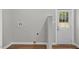 Practical mud room, equipped with storage and an exterior door, enhances convenience for daily living at 830 S Chestnut St, Henderson, NC 27536