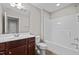 Full bathroom with a sleek vanity, toilet, and a shower-tub combo, offering functionality and style at 850 Apalachia Lake Dr, Fuquay Varina, NC 27526