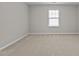 Cozy bedroom with a window for natural light, providing a peaceful retreat at 850 Apalachia Lake Dr, Fuquay Varina, NC 27526