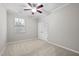 Bedroom with neutral carpeting and trim, a ceiling fan, and a double-door closet at 850 Apalachia Lake Dr, Fuquay Varina, NC 27526